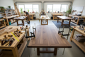 Wooden table cutting and assembly process in a workshop